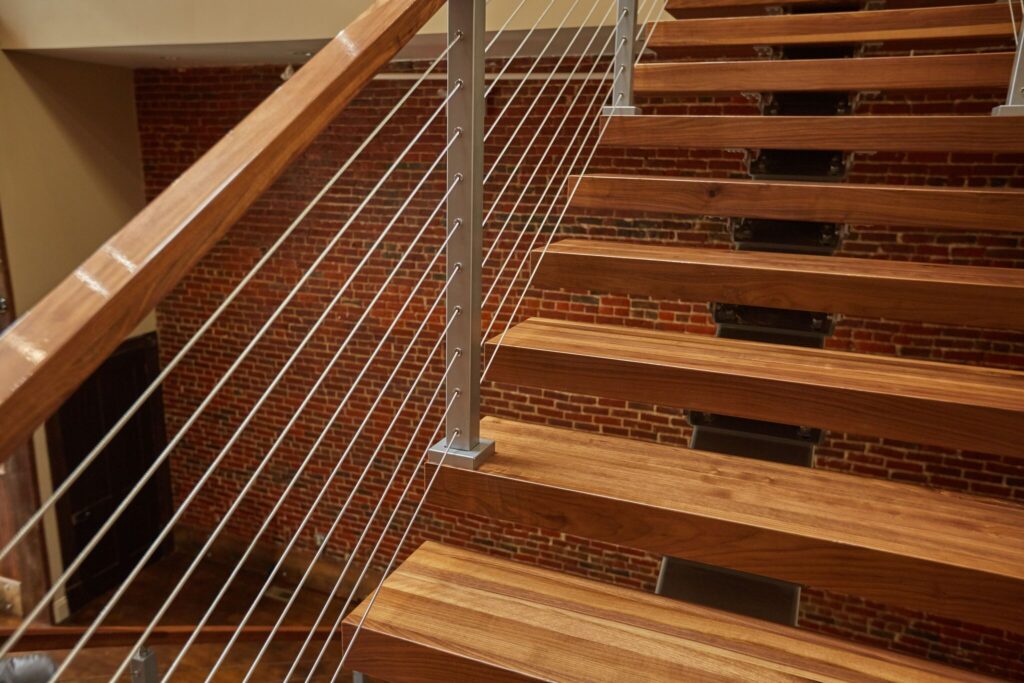 Cable railing on floating stairs closeup