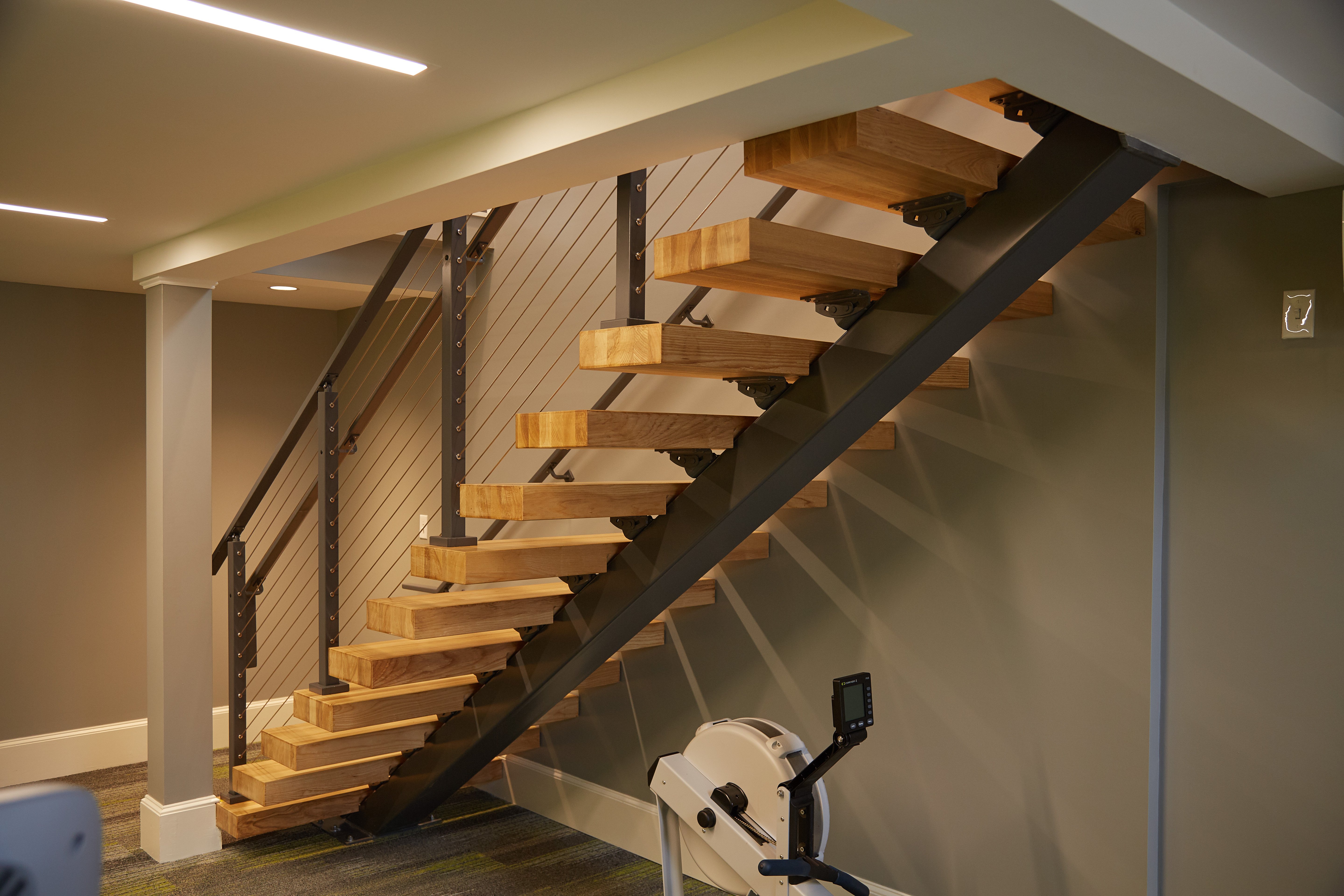 Floating Staircase Install in Modern Gym Viewrail