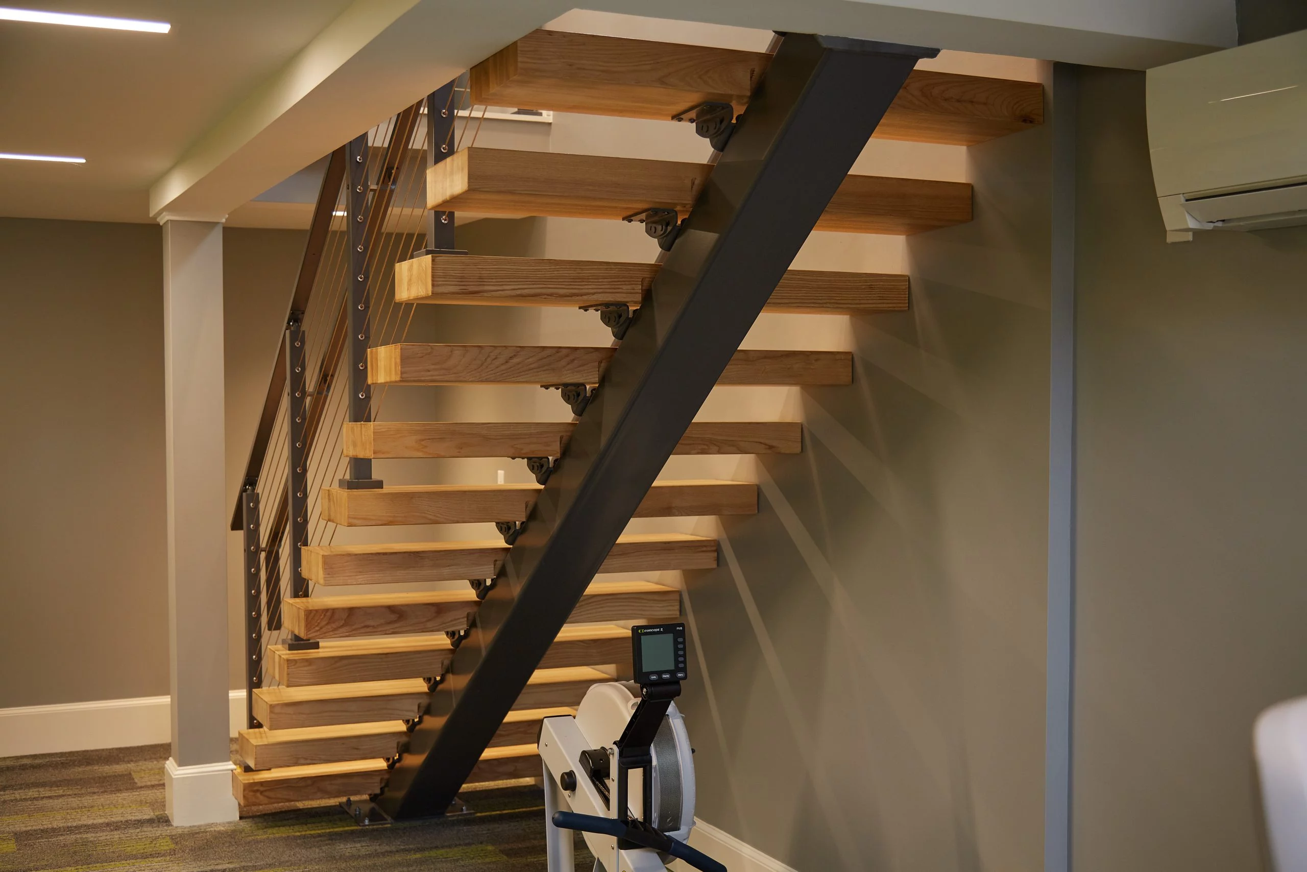 Floating Staircase Install in Modern Gym Viewrail