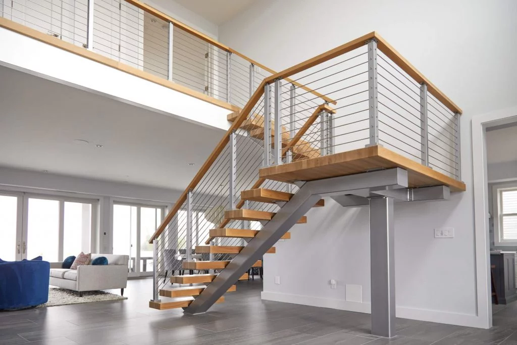 Floating stair treads with wooden handrail