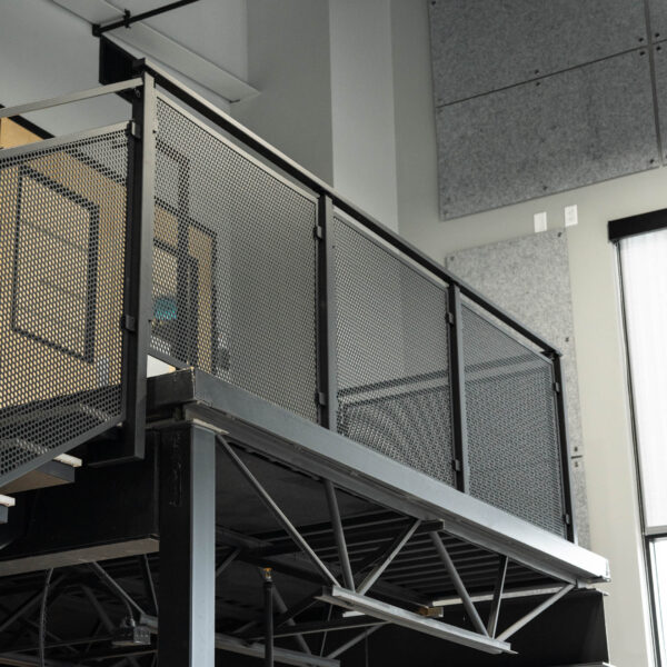 Floating Stairs with Porcelain Treads and Perforated Railing Panels ...