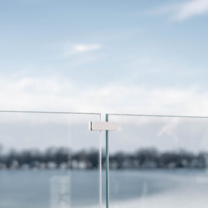 Glass Railing with Icy White Accents on a Frozen Lake - Viewrail