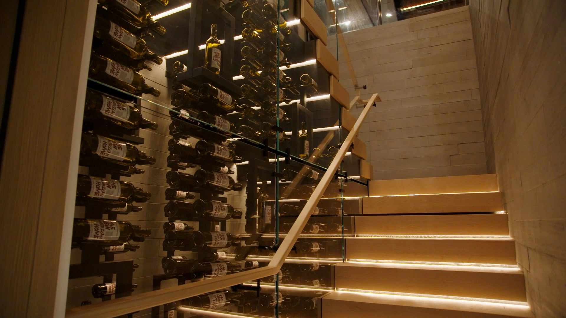 FLIGHT Stack with Vedera Glass railing built to surround a custom wine rack.