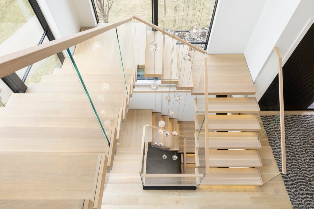 Viewrail Flight Mono System stairs and glass railing spiraling down to lower levels