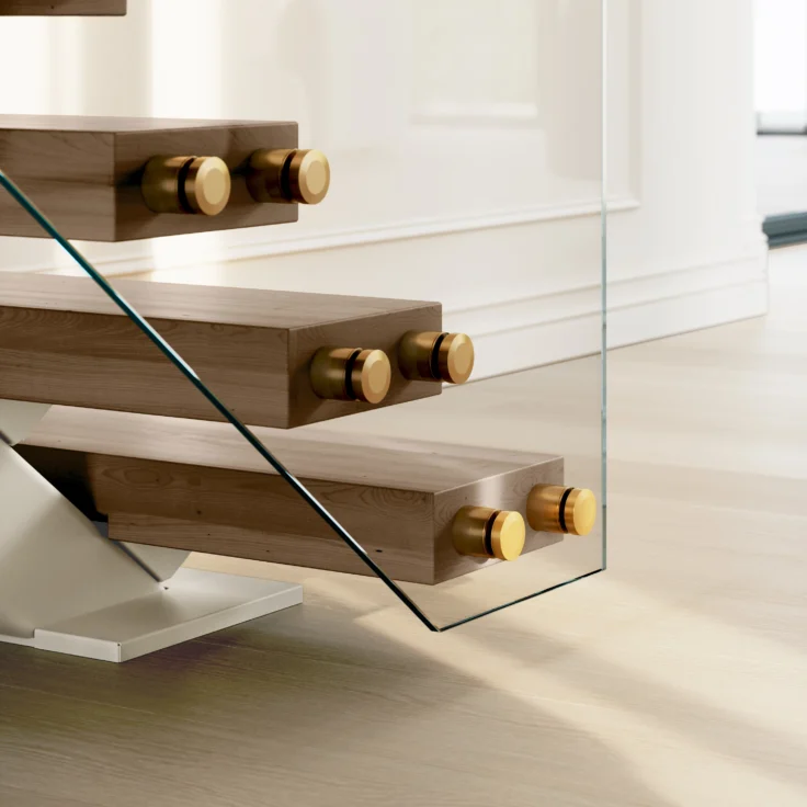 Close up of FLIGHT Mono treads and brass standoff pins for the glass railing.
