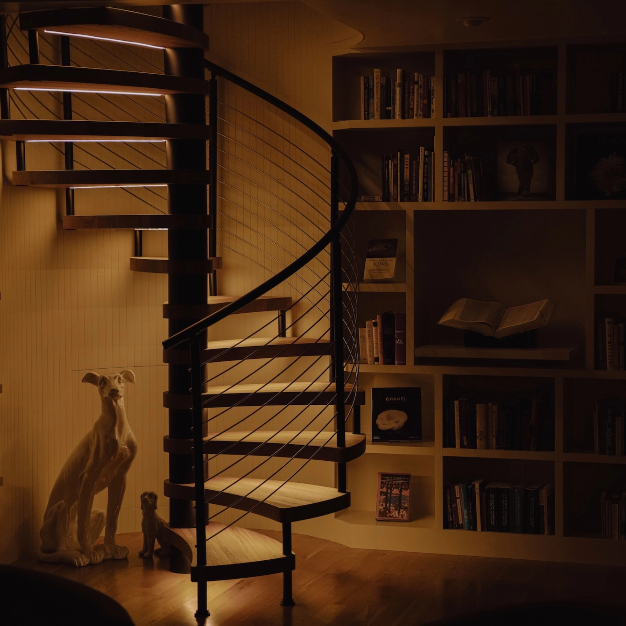 A FLIGHT Spiral lights a room at night using treads with integrated LED