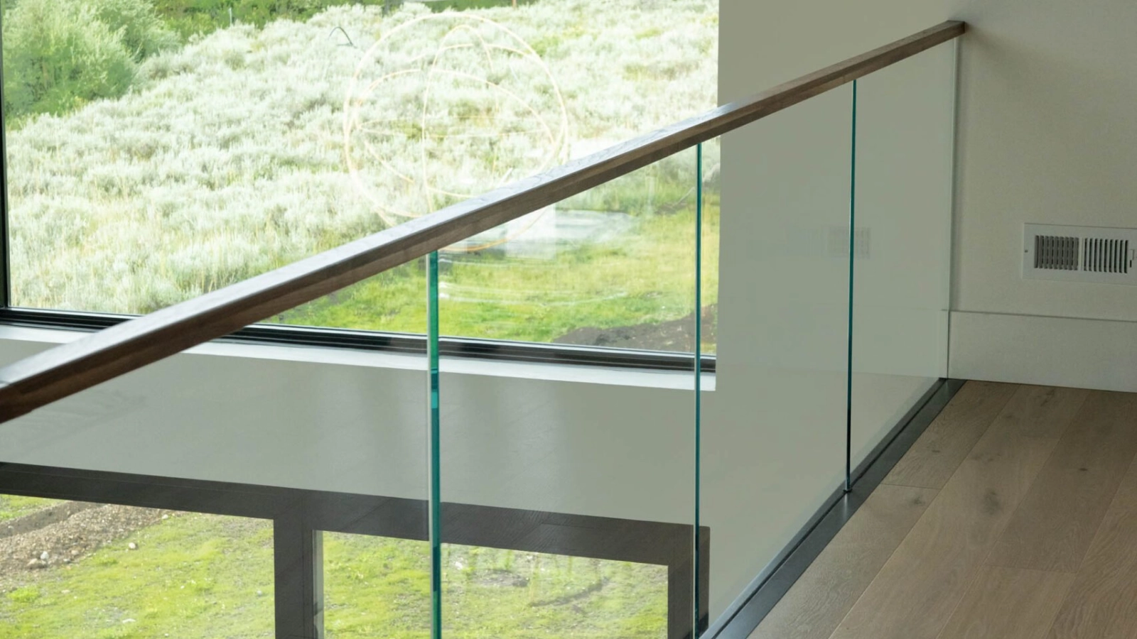 Indoor balcony with glass railing