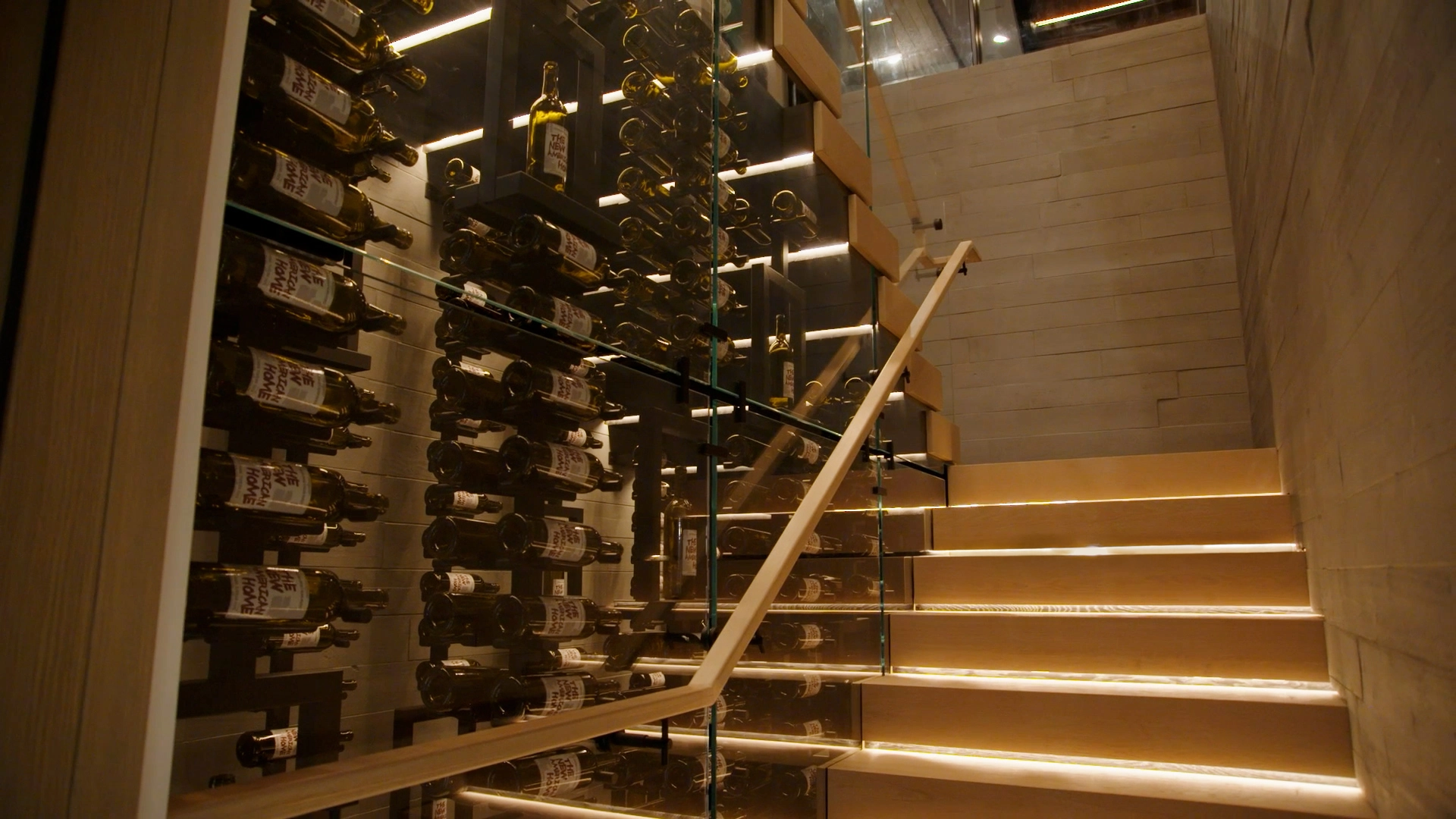 FLIGHT Stack with Vedera Glass railing built to surround a custom wine rack.