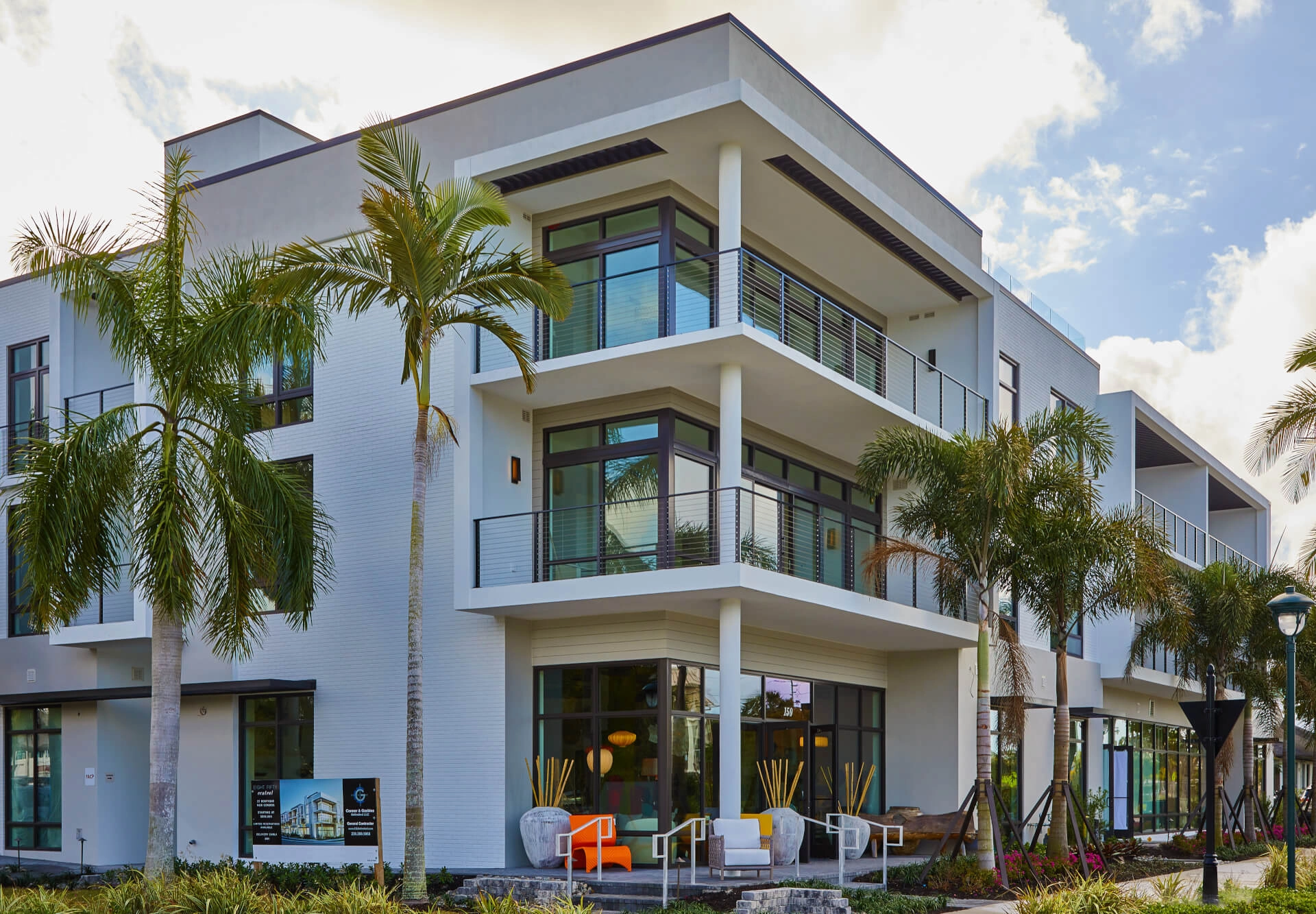 A multi-unit complex in Naples, FL with Express railing on all balconies and walkways.