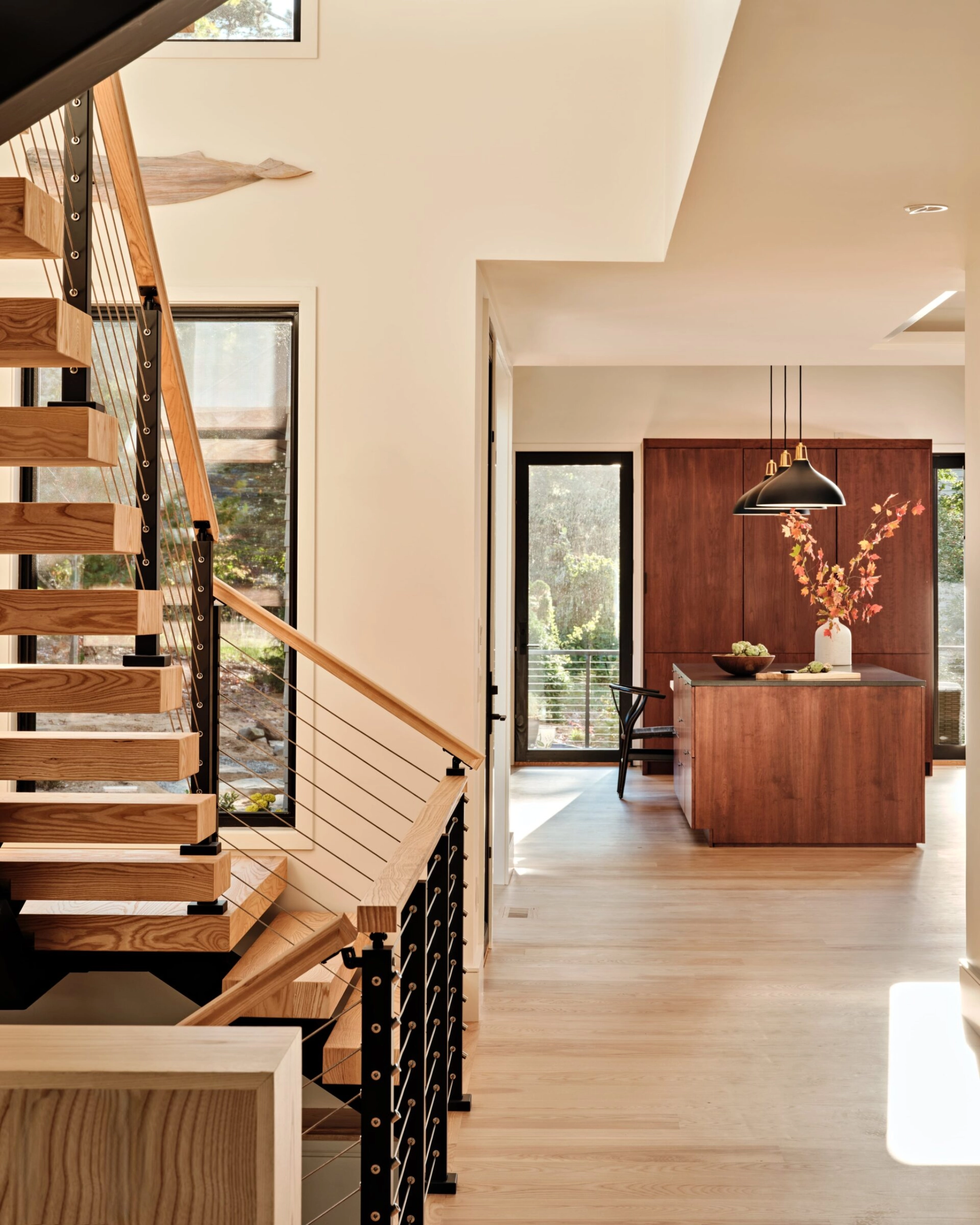 Signature cable railing with wood handrail on a FLIGHT Mono system.