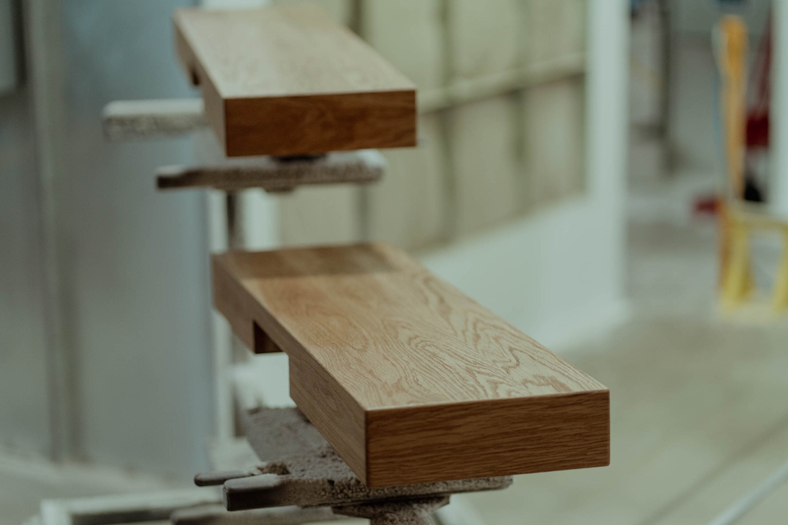Solid hardwood stair treads on the finishing line